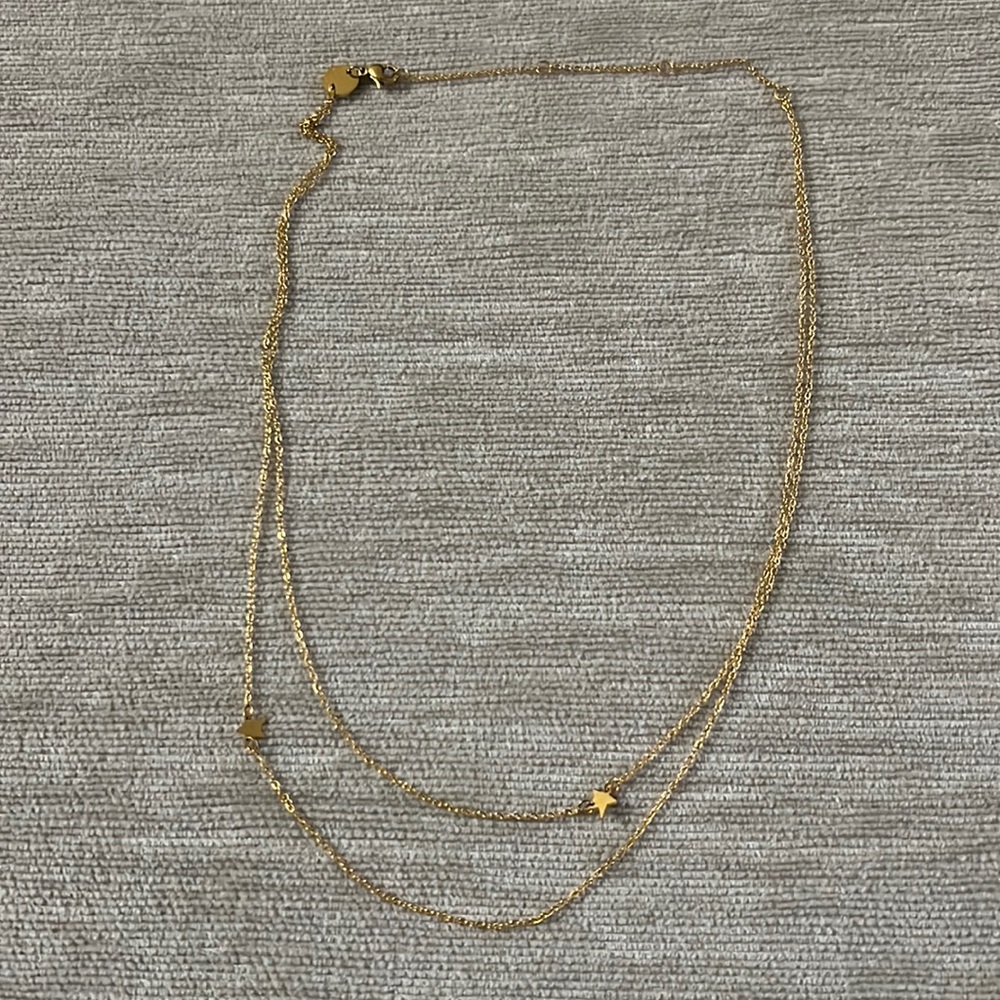 Gold colored star necklace